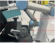 UR5 medical teleoperation setup uses a Geomagic Touch haptic device and a foam patient model.